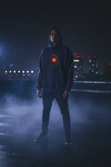 Navy blue hoodie with a small graphic on the chest against a white background